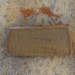 Metallic Gold with rhinestones evening clutch with chain strap.